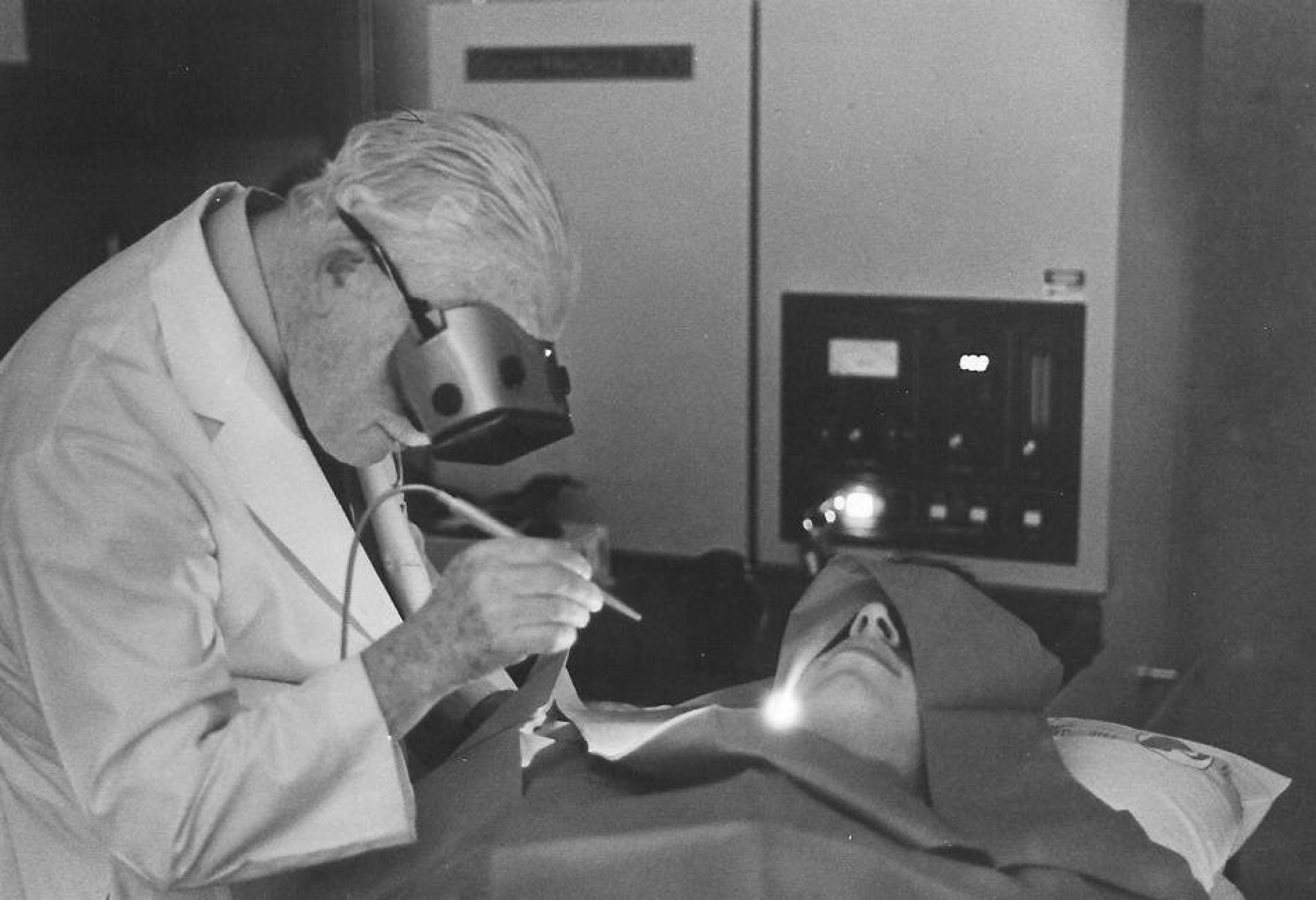 Physician demonstrating a laser procedure